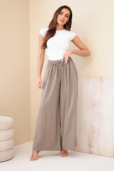Bezowe spodnie damskie szerokie palazzo z elastycznym pasem i wiazaniem