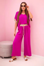 damskie ubrania z wiskozy pudrowy róż ze złotym wykończeniem