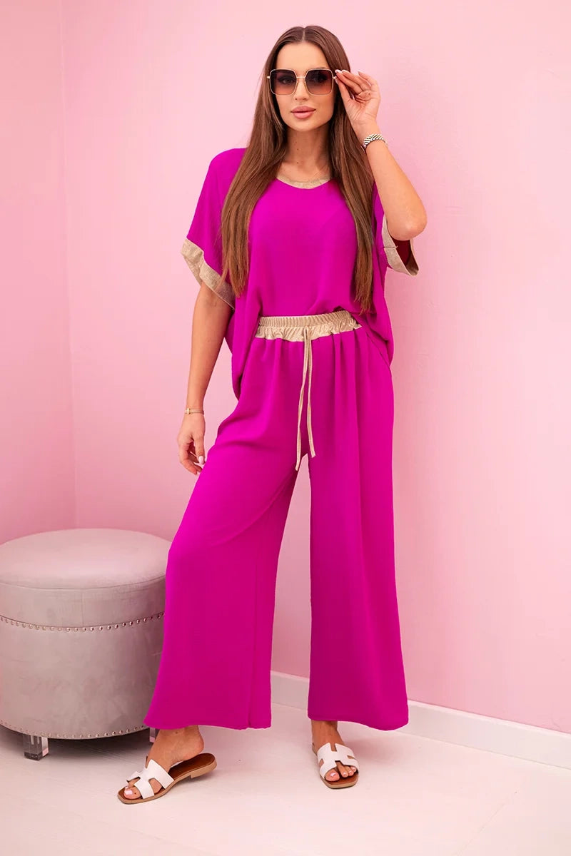 damskie ubrania z wiskozy pudrowy róż ze złotym wykończeniem