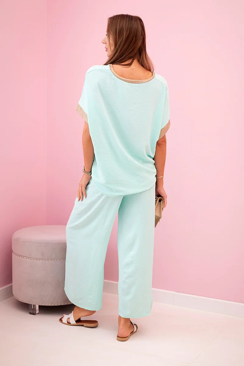 damskie spodnie z wiskozy w ciemnym pudrowym różu ze złotym obszyciem