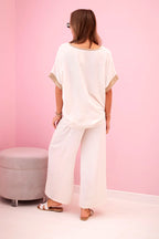 damskie spodnie z wiskozy w kolorze ciemnego pudrowego różu ze złotym obszyciem