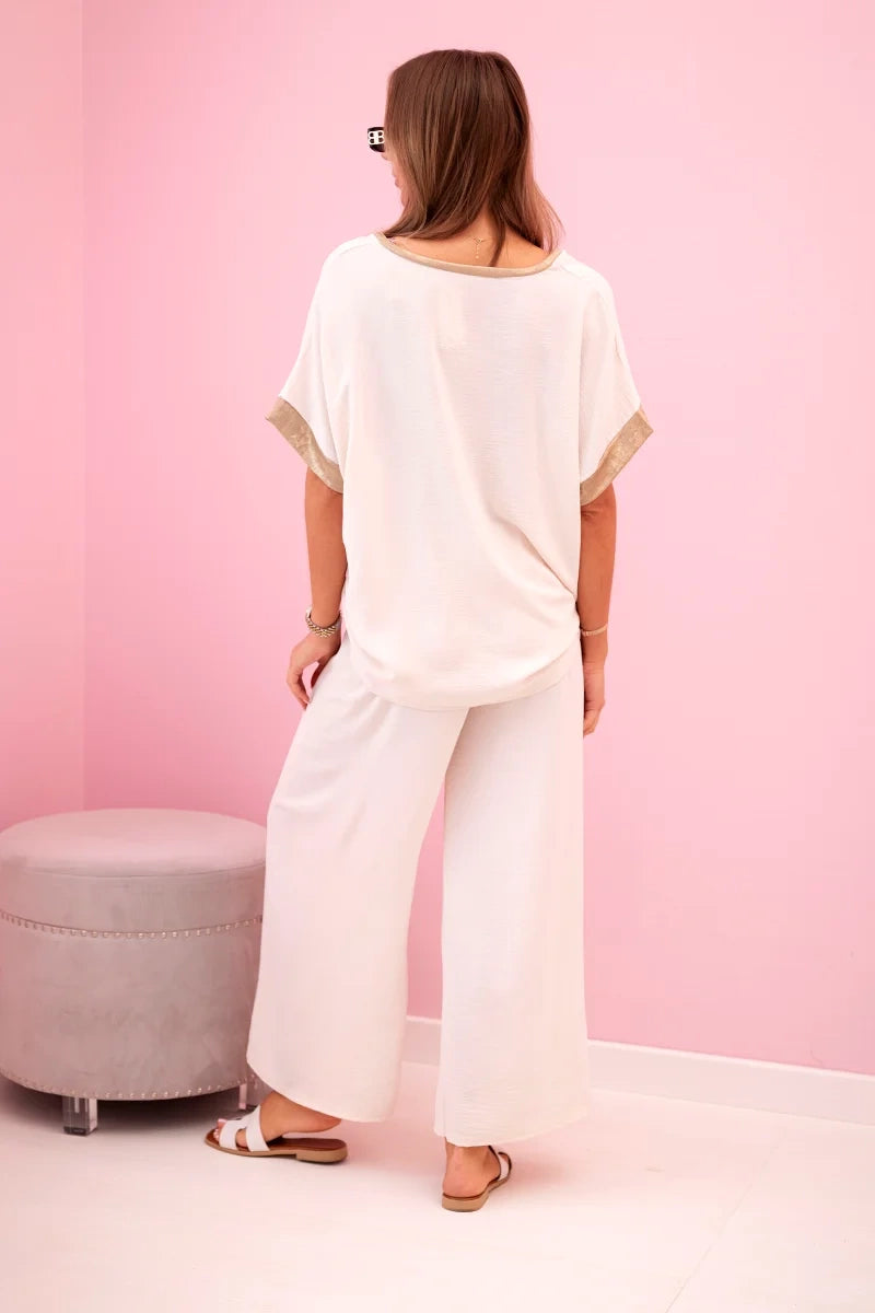 damskie spodnie z wiskozy w kolorze ciemnego pudrowego różu ze złotym obszyciem