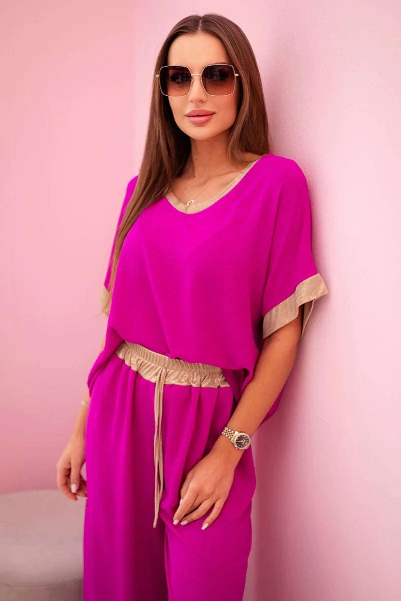 damskie ubrania z wiskozy w ciemnym pudrowym różu ze złotym obszyciem