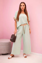 damskie spodnie i top z wiskozy w pudrowym różu ze złotym wykończeniem