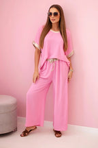 damskie ubrania z wiskozy pudrowy róż złote wykończenie